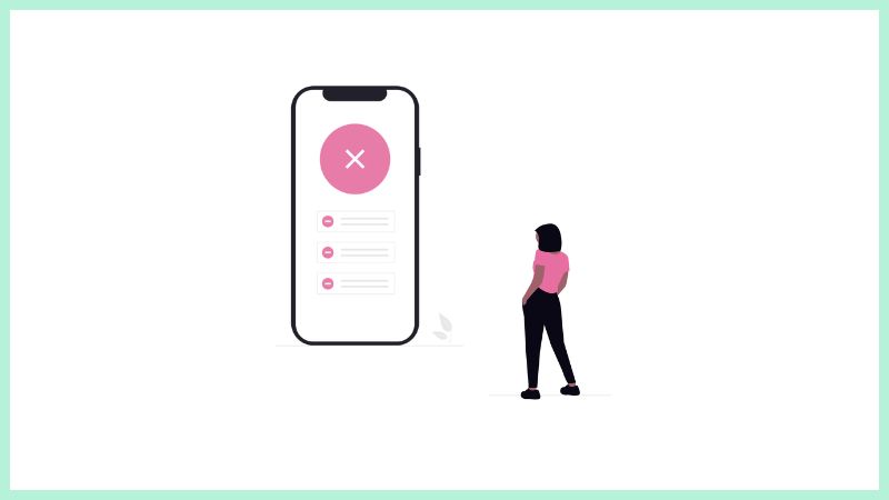 女性が、赤い×印が表示されたスマホ画面を見て、驚きとショックを隠せない様子。エラー発生の瞬間をイメージ。